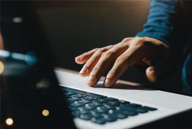 Person typing on a laptop